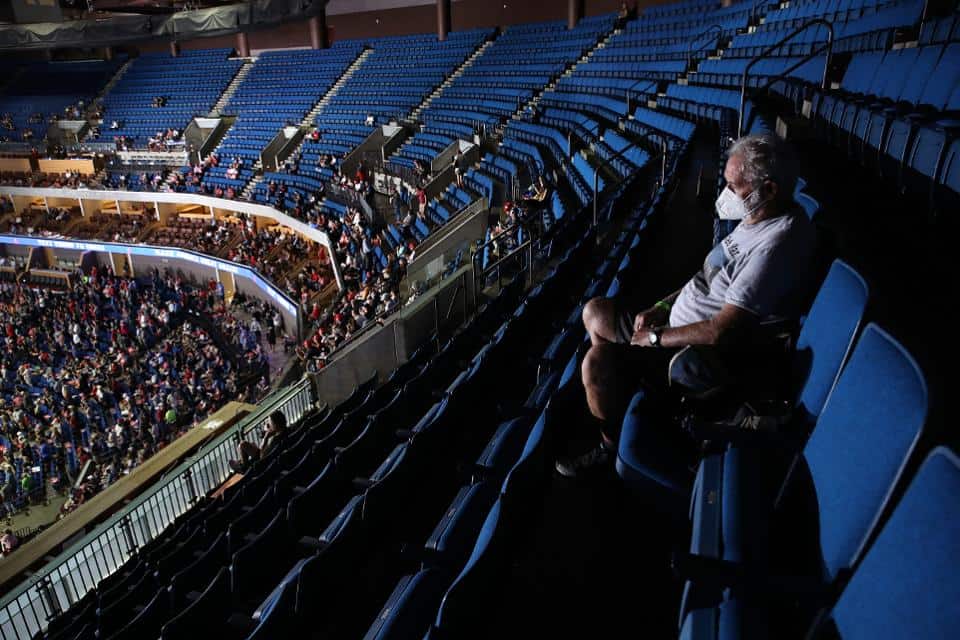 Trump campaign removes social distancing stickers at his sparsely attended Tulsa rally.