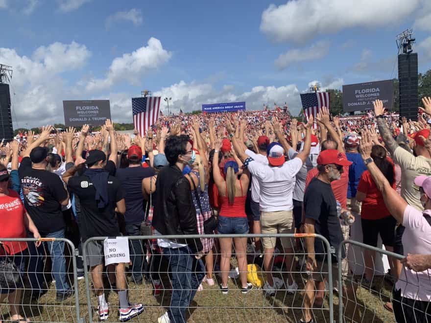 Multiple Trump supporters pass due to extreme heat at his rally in Tampa, Florida.