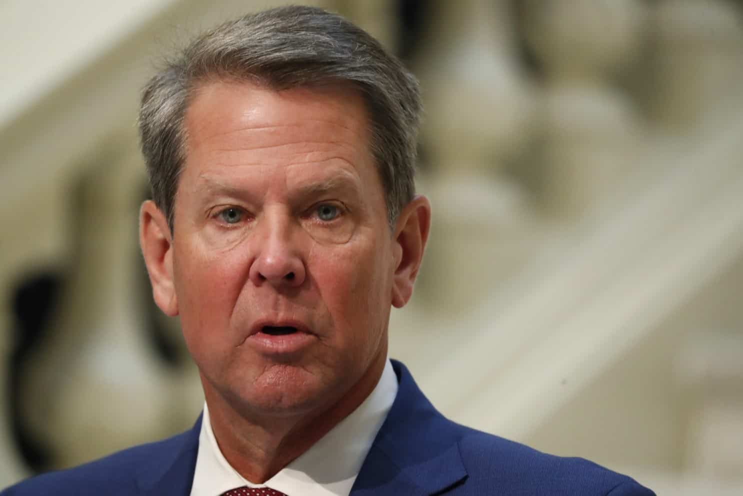 No shame: Georgia governor Brian Kemp attends Christmas party at the White House despite Trump's attacks.