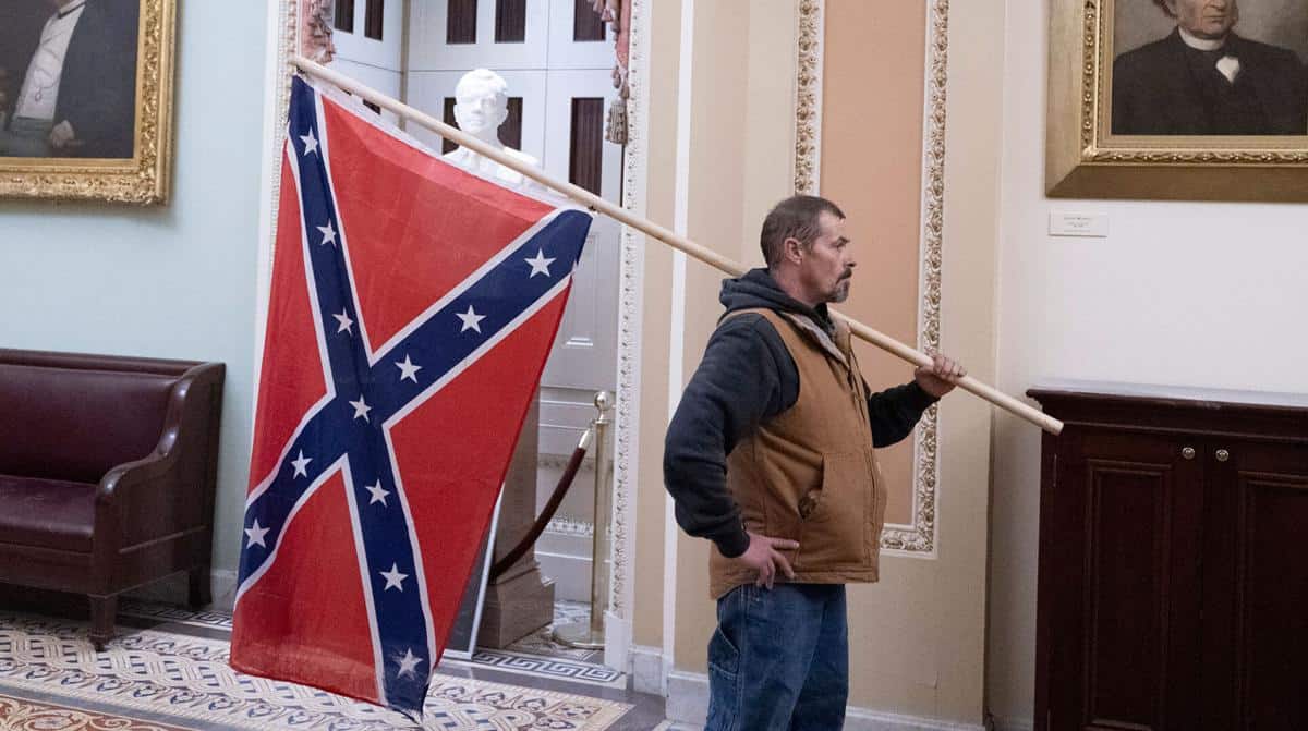 Man who carried Confederate flag into the Capitol arrested.