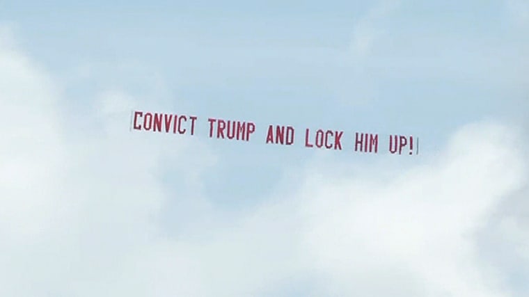 "Convict Trump" banner flies over Mar-a-Lago.