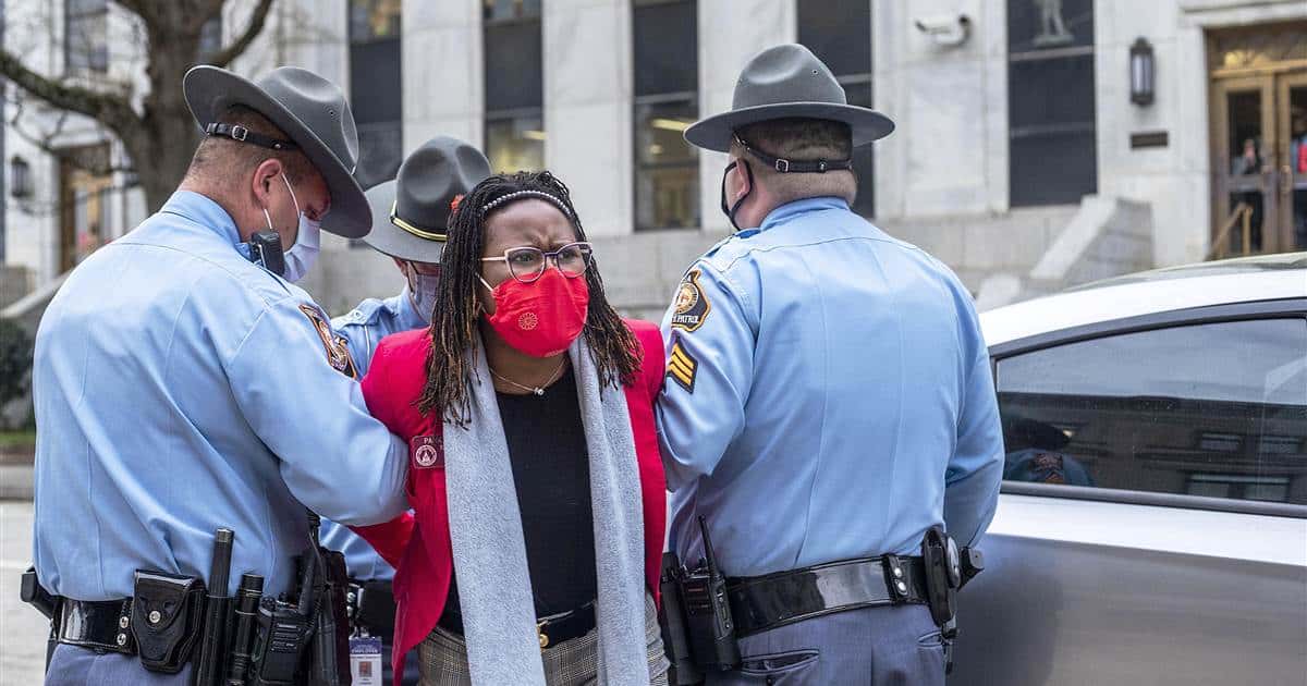 Trooper who arrested Georgia state rep was worried about "emboldened" protesters storming the state Capitol.