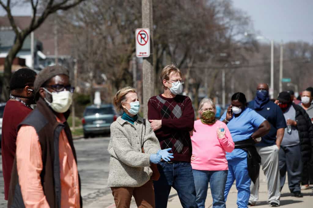 CDC: Vaccinated people can now remove masks in most group settings.