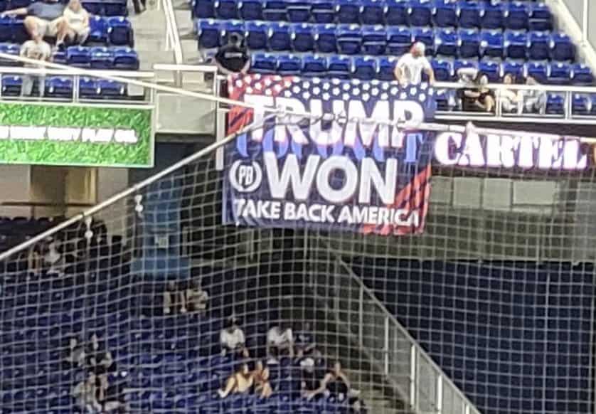 Multiple people kicked out of baseball game hanging "Trump won" and "Proud Boys" banners.