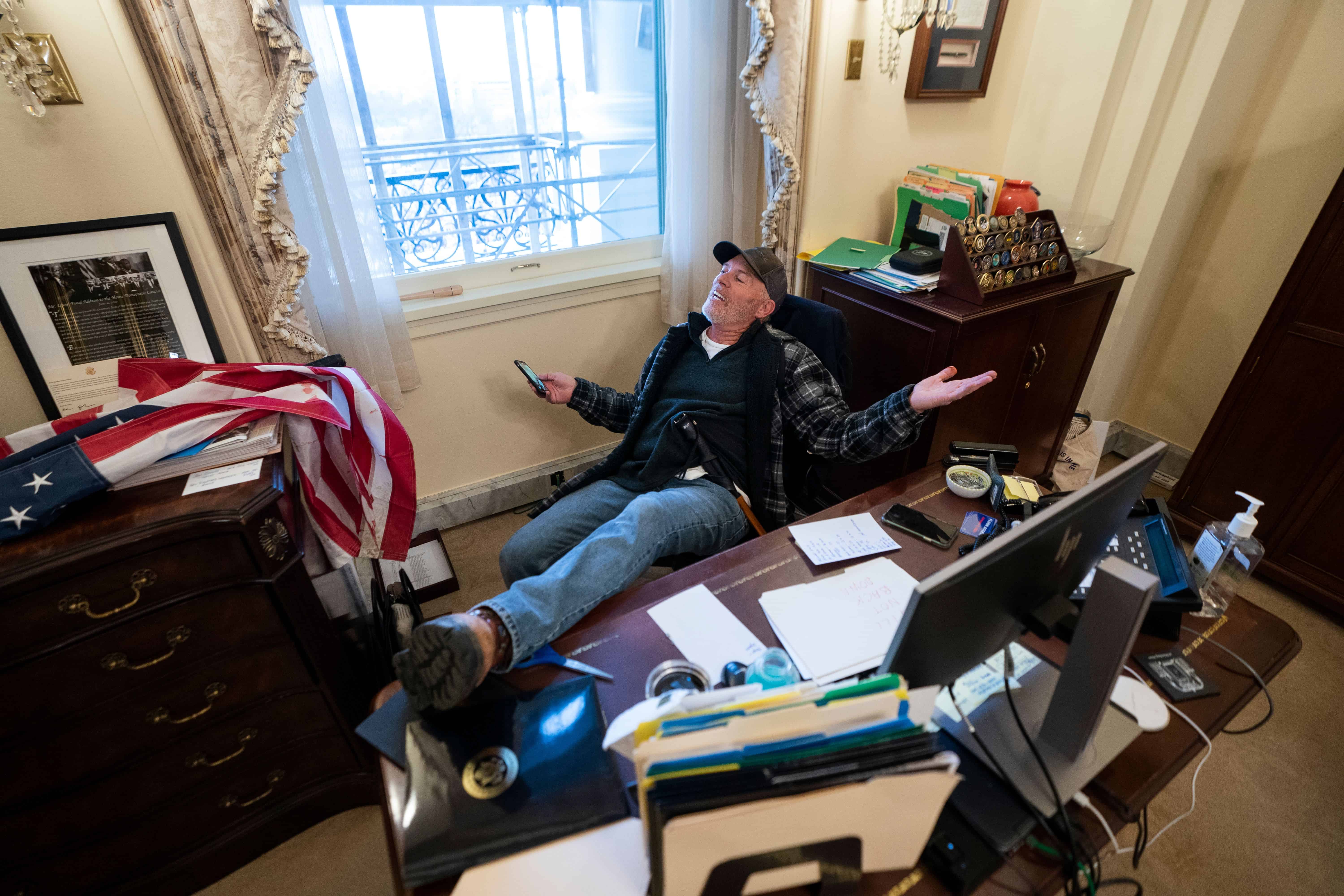 Capitol rioter who put his feet on Pelosi's desk asked court for permission to attend a car show.