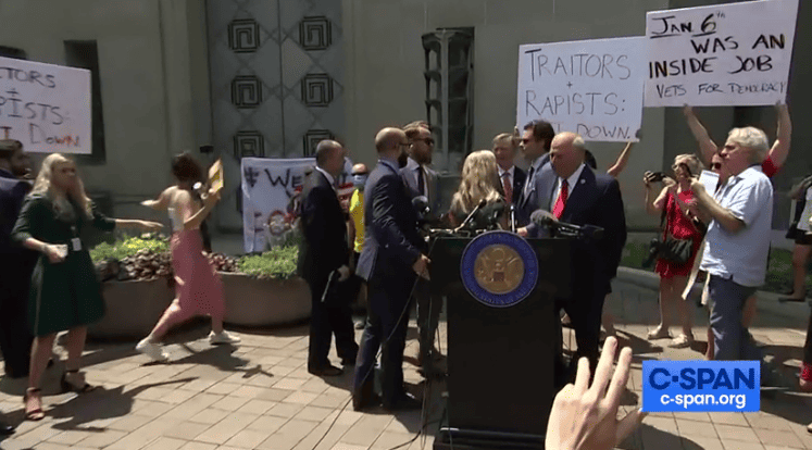 Republican lawmakers' press conference at DOJ derailed by protesters.