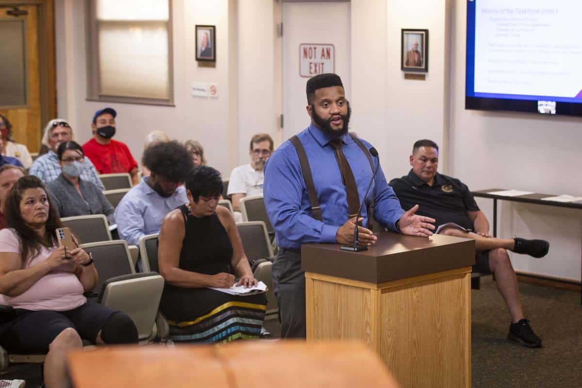 Man threatened to stone gay city official at council meeting.