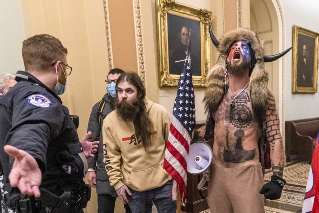 QAnon Shaman' who stormed Capitol in horns should spend 51 months in prison, prosecutors say: Report.