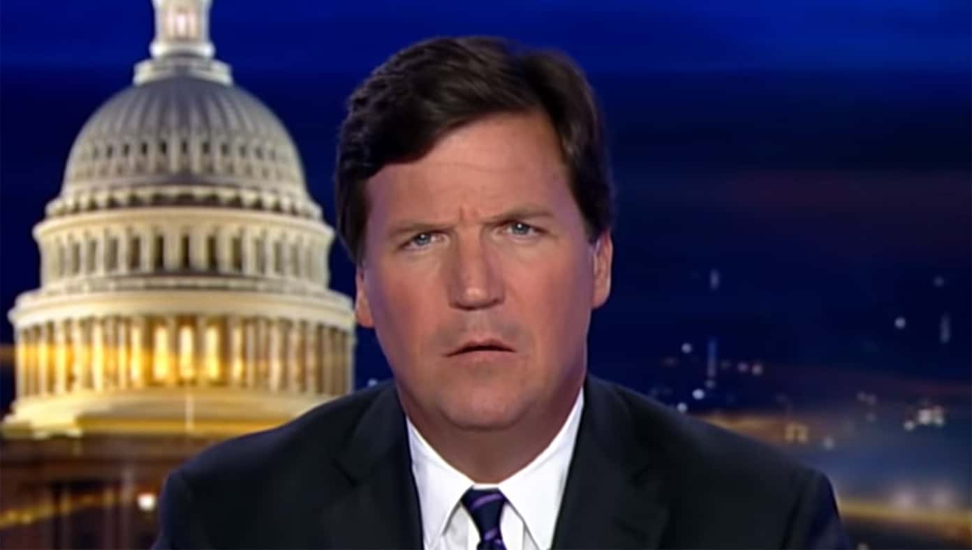 Tucker Carlson looks to profit off anti-vaccine mandate protest in Canada.