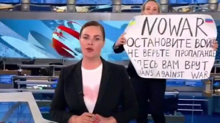 Anti-war protestor disrupts live Russian State TV news shouting 'stop the war'.