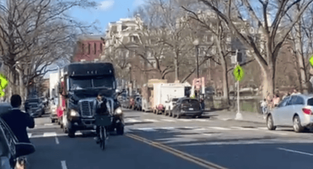 One cyclist slows DC trucker protest to a crawl.