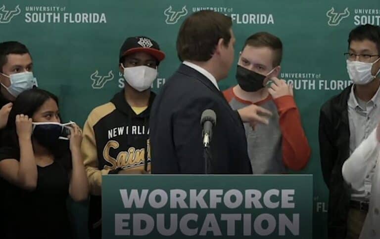 Ron DeSantis is fundraising off video showing him scolding students for wearing masks.