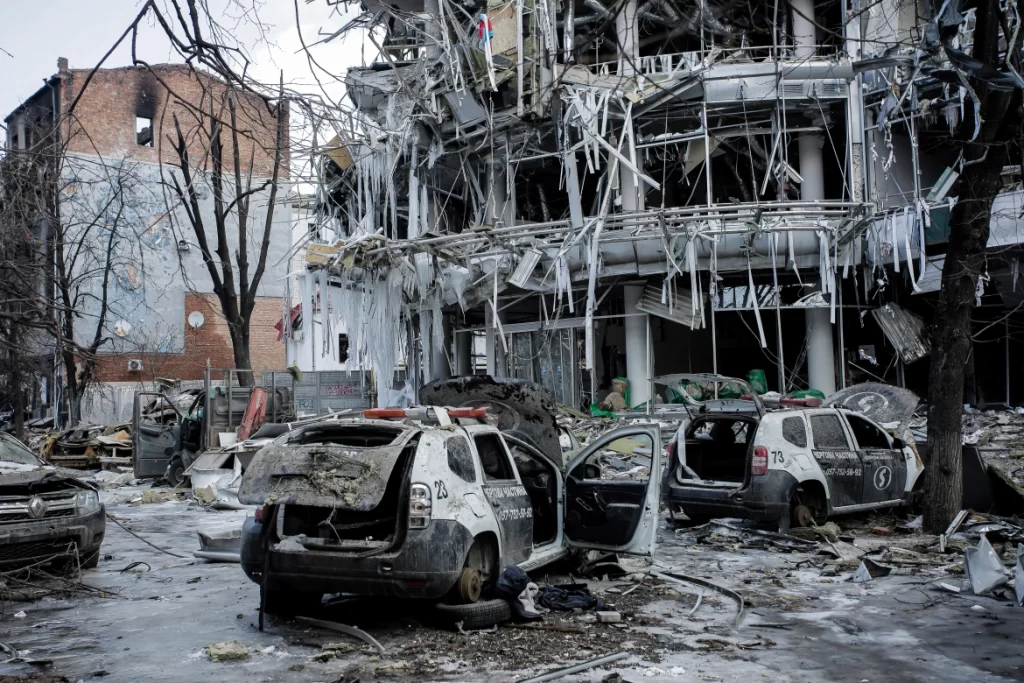 Damaged vehicles and buildings in Kharkiv city centre [Pavel Dorogoy/AP Photo]