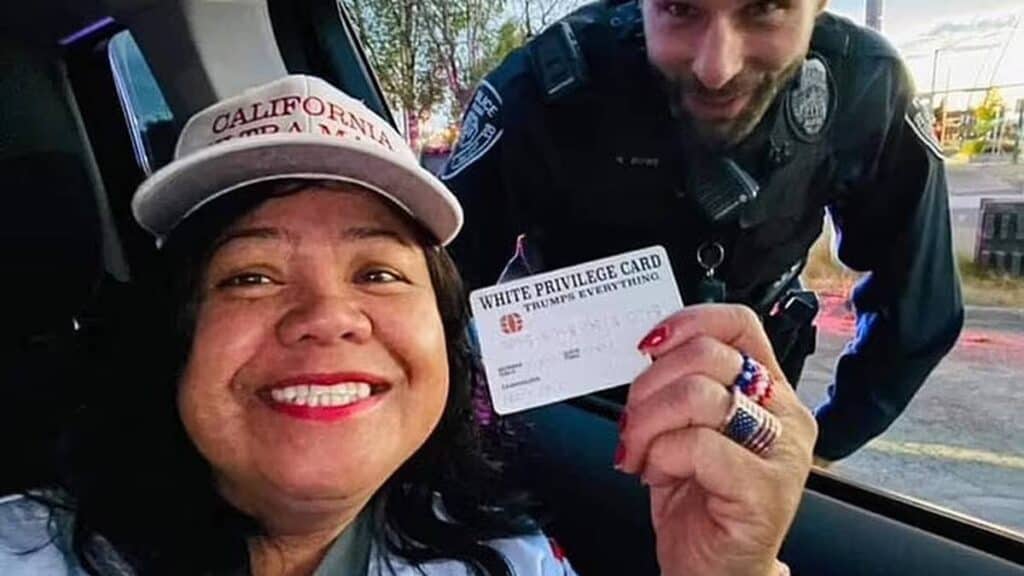 Woman avoids ticket after showing officers a 'white privilege card' during traffic stop.