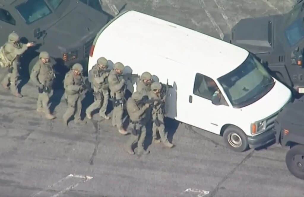 Body found in driver's seat of the van linked to suspect who killed 10 in California.