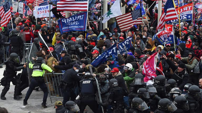 Capitol rioter faces new charges after firing at officers checking on him.