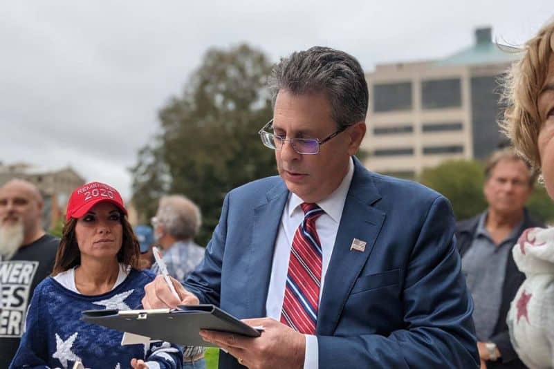 Trump-backed Michigan attorney general candidate charged for tampering with voting machines.