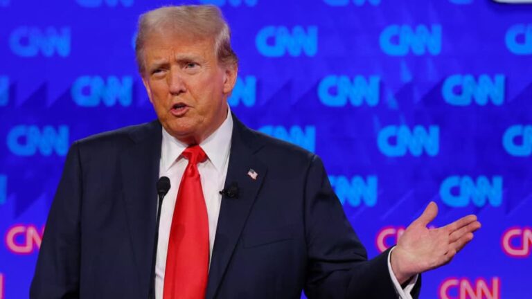 Trump says he would rather have mics on during debate, undermining his campaign efforts.