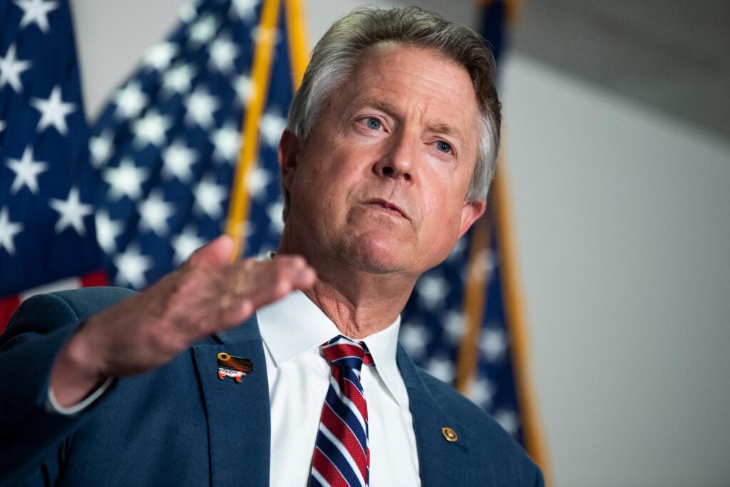 Republican senator booed after leaving town hall early when pressed about DOGE cuts.